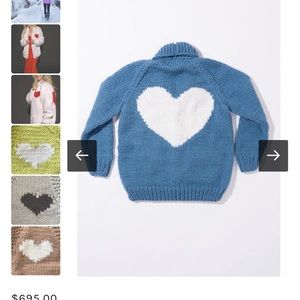 Never been worn GOGO sweater with Beauty on arm sleeve. One size.